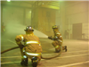 Firefighters training with fire hose
