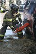 Firefighter using cutting tool