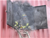 Firefighter in smokey window