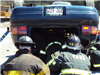 Firefighters and Upside Down Car