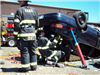 Firefighters and Upside Down Car