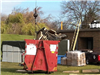 Dumpster filled with roof parts