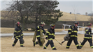 Firefighters walking with equipment