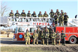Firefighters in front of fire truck