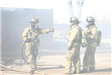 Firefighters surrounded by smoke