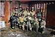 Firefighters posing in burn house