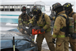 Firefighters cutting into car