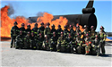 FIrefighters posing in front of fire