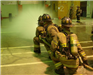 Firefighters spraying hose