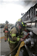 Firefighter working on fire truck