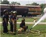Firefighters using fire hose
