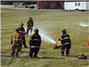 Firefighters training with hose